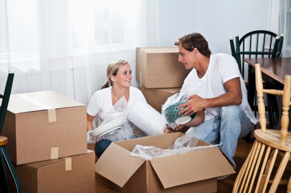 Couple unpacking household items